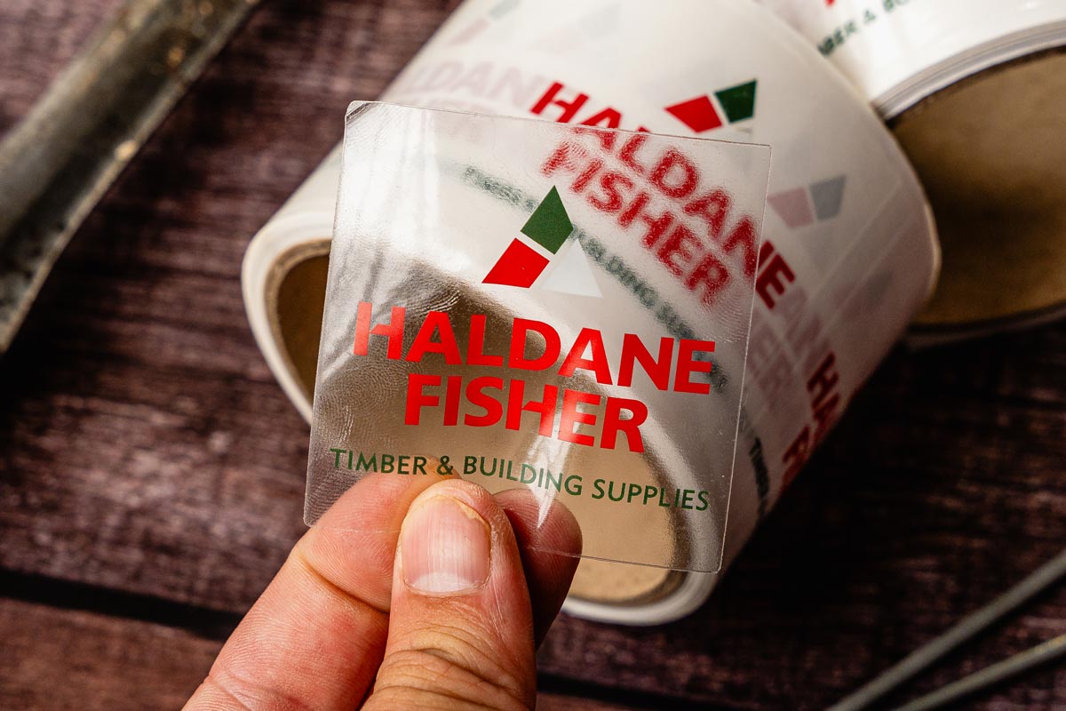 Firkantet transparent klistermærke med Haldane Fisher logo